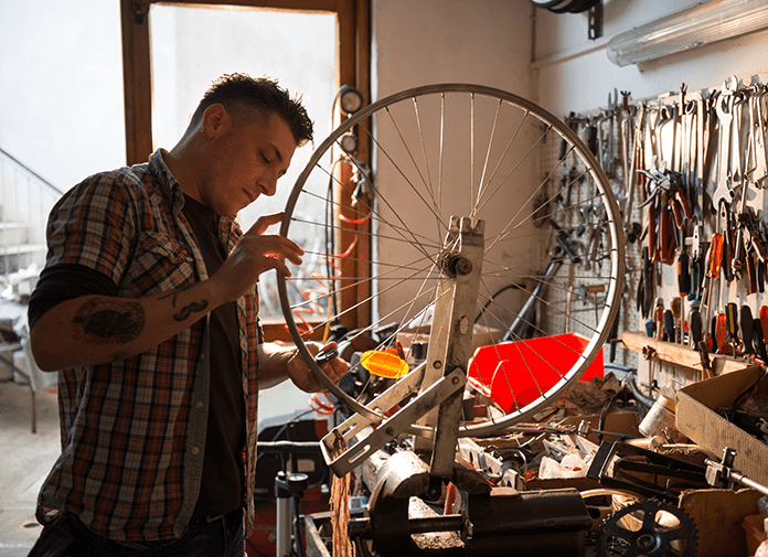 man fixing bike