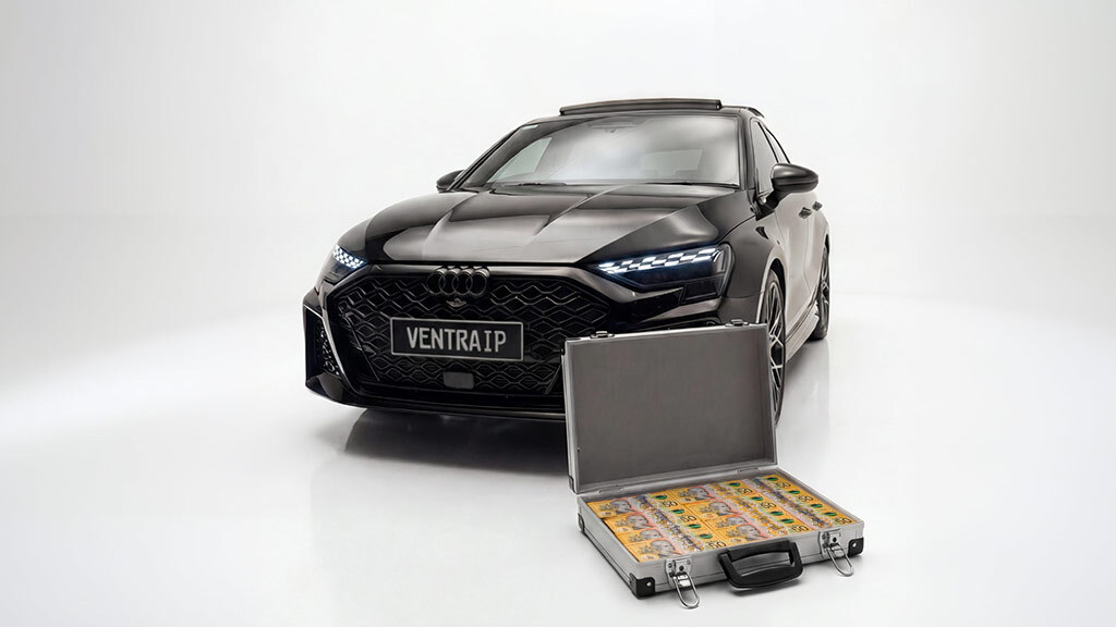 Image of a black Audi RS3 and a silver suitcase filled with $50 bills totalling $100,000 cash. 